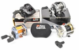 Four Abu Ambassadeur multiplier / bait fishing reels including Ultra Cast and 821 Flipping, two
