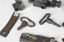 A collection of target rifle sights including Parker-Hale Mk7 diopter sight with peep iris, ladder