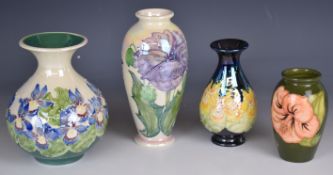 Moorcroft vase decorated in the Hibiscus pattern and three Lise B Moorcroft vases, tallest 17cm