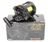 Shimano Triton Beast Master 4/0 multiplier fishing reel, boxed with paperwork and accessories