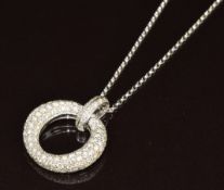 An 18k white gold pendant set with diamonds (2cm), on 18ct white gold chain, 7.4g, 44cm