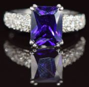 A 9k white gold ring set with paste and diamonds to the shoulders, 3.6g, size O