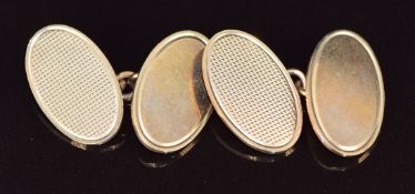 A pair of 9ct gold oval cufflinks with engine turned decoration, Birmingham 1986, maker Deakin &