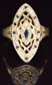 An 18ct gold ring set with sapphires and paste in a marquise setting (stones missing), 4.3g, size V