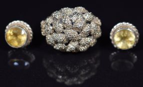 A 9ct gold ring with textured finish and a pair of 9ct gold earrings each set with a citrine, 7.