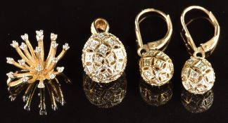 A 9k gold egg pendant set with diamonds (2g) with matching earrings (damaged) and a 9k gold pendant,