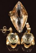 A 9ct gold ring set with a marquise cut smoky quartz and 9ct gold earrings set with oval smoky