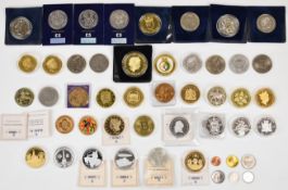 A collection of various UK and overseas commemorative crown sized coins etc including £5 examples,
