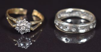 An 18ct gold ring set with diamonds (3.2g, band cut) and a 9ct gold ring (2.7g, damaged)