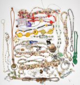 A collection of jewellery including three silver bracelets set with abalone and labradorite, tiger's