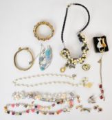 Costume jewellery including silver angel charm, silver tree of life pendant, pearl necklace and