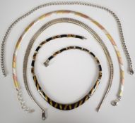 Four silver necklaces, one set with tiger's eye and enamel, 114g