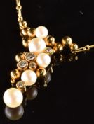 An 18ct gold pendant set with cultured pearls and diamonds in an abstract design, the total