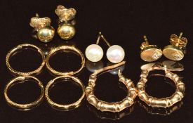 Five pairs of 9ct gold earrings including bamboo design hoops, pearls, etc , 3.1g