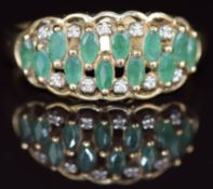 A 9k gold ring set with marquise cut emeralds and diamonds, 3.2g, size U