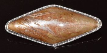 A c1920 silver lozenge shaped brooch set with butterfly wing, silver back marked 925, length 5cm