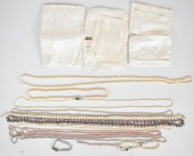Ten pearl necklaces, one with silver clasp, together with four children's pearl bracelets all with