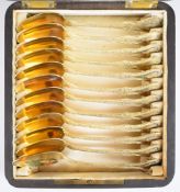Cased set of twelve French silver gilt teaspoons with French silver marks and maker's mark of