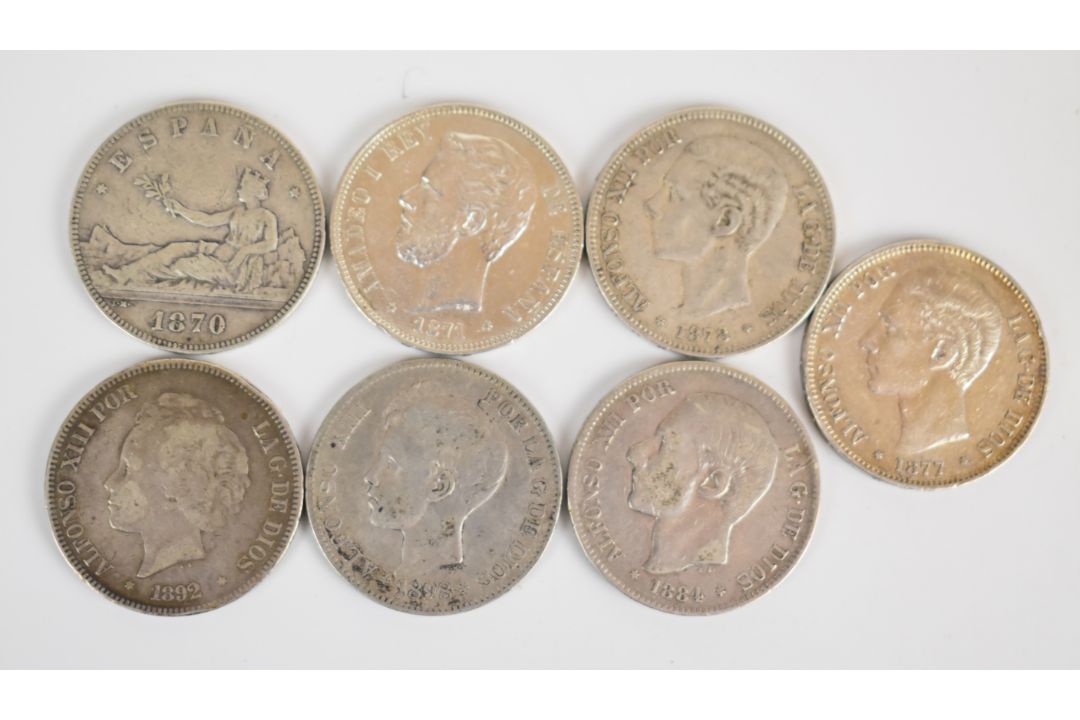 Seven Spanish 5 Pesetas coins comprising 1870, 1871, 1877, 1878, 1884, 1892 and 1898 examples - Image 1 of 2