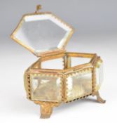A 19th century ormolu and bevelled glass jewellery box with silk lining, W9 x H6cm