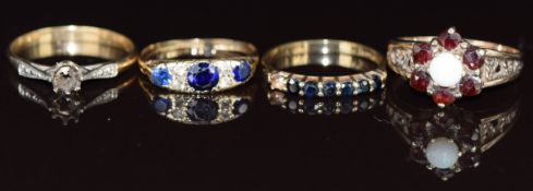 Three 9ct gold rings, one set with an opal and garnets, one sapphires and cubic zirconia and the