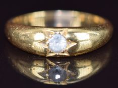 An 18ct gold ring set with paste in a star setting, 4.6g, size P