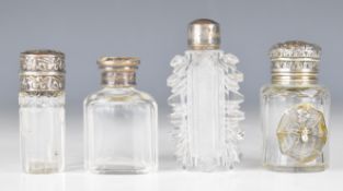 Four hallmarked silver and similar mounted glass scent bottles, one with mother of pearl Shibayama