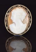 A 9ct gold brooch set with a cameo of a young woman, 7.8g, 3 x 3.5cm
