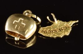 A 14k gold bell charm (2.2g) and an 18ct gold charm 'Madeira' (0.8g)