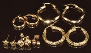 Six pairs of 9ct gold earrings including stars, knots and hoops, 5.1g