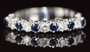 An 18ct white gold half eternity ring set with alternating sapphires and diamonds, 3.1g, size R