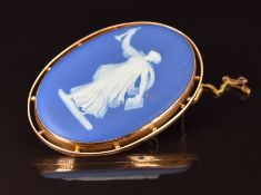 A 9ct rose gold brooch set with a Wedgwood cameo, 32.1g, 6.5 x 4.5cm