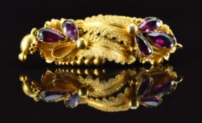 Victorian Etruscan Revival brooch set with foiled garnets, 3.4g, 3.5cm