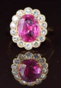 An 18k gold ring set with an oval cut natural unheated pink sapphire of approximately 3.68ct