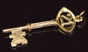 A 9ct gold charm in the form of '21' and a key by Nuno, 2g, 3cm