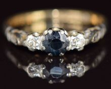 An 18ct gold ring set with a sapphire and diamonds, 2.7g, size N