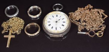 A 9ct gold cross and chain (3.6g), two 9ct gold eternity rings (4.5g), a silver ring, silver fob