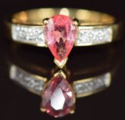 An 18ct gold ring set with a pear cut Padparadscha sapphire of approximately 0.7ct and diamonds, 4.