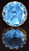 An 18k gold ring set with a round cut synthetic spinel, 8.5g, size L
