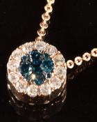 A 14k rose gold pendant set with a cluster of champagne diamonds surrounded by further diamonds,