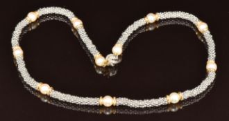 A 14k white gold and yellow gold necklace set with cultured pearls, 54g, 45cm