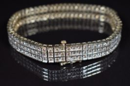 A 9k gold bracelet set with three rows of champagne diamonds, 26g, 18.5cm