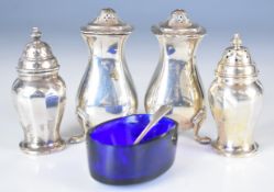 Two pairs of hallmarked silver peppers, one pair London 1925, maker Edward Barnard & Sons Ltd,