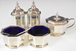 Art Deco hallmarked silver five piece octagonal cruet set with blue glass liners, two matching