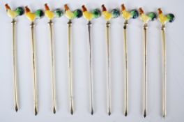 Nine silver and enamel novelty cocktail sticks with cockerel finials, marked sterling silver, length