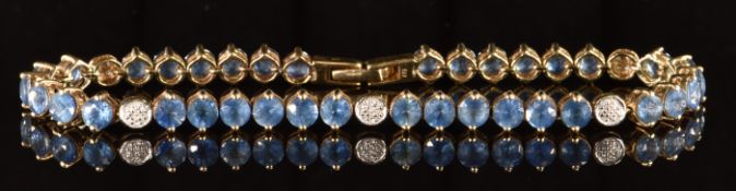 A 9k gold bracelet set with 36 round cut Kanchanaburi sapphires, the total sapphire weight