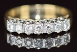 A 9ct gold ring set with seven diamonds, each approximately 0.04ct, 2.8g, size N