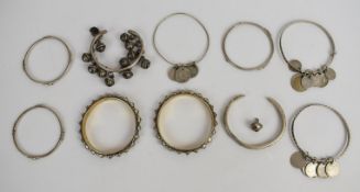 Three matching Indian silver bangles, three silver bangles with Indian silver / white metal coin