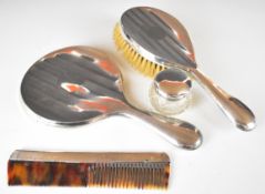 George V hallmarked silver hand mirror and brush, mirror Chester 1921, maker J & R Griffin Ltd,