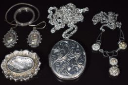 A collection of silver jewellery including locket, chain, brooch, Victorian earrings with applied